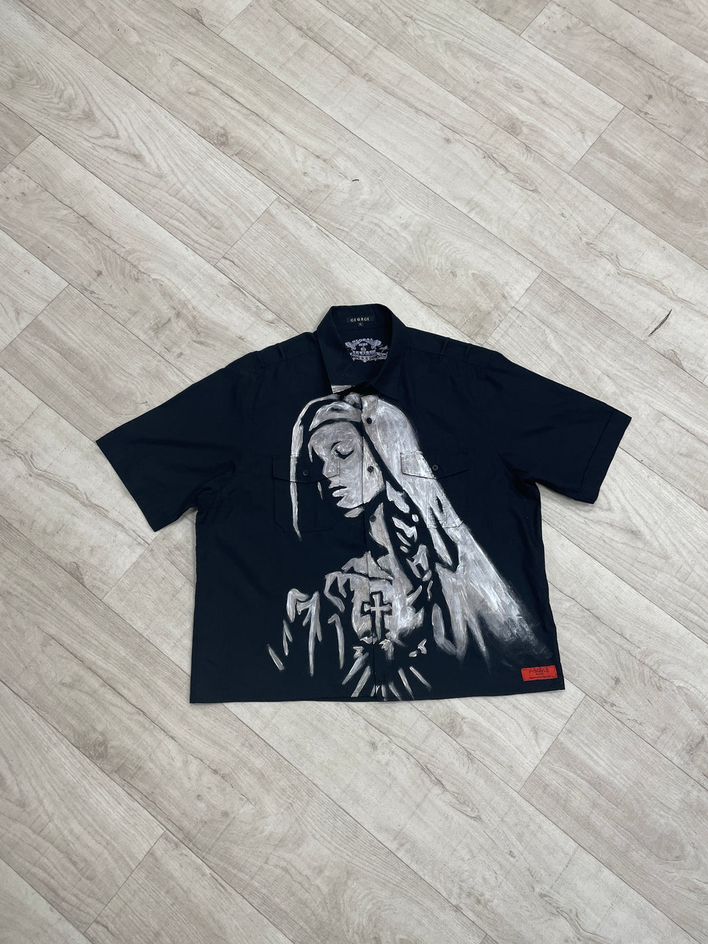 Black shirt with Virgin Mary graphic design